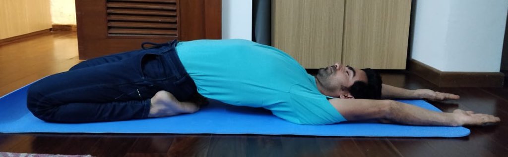 Ex-Indian cricketer Mohammad Kaif performs yoga indoors