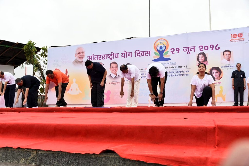 Vice President M Venkaiah Naidu and Maharashtra Chief Minister Devendra Fadnavis perform yoga in Mumbai